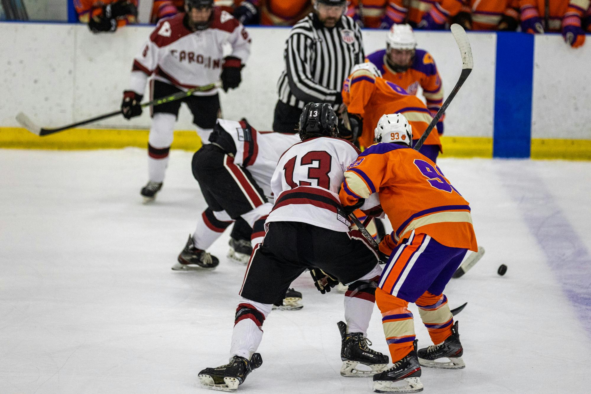 Senior center Owen Thomas battles against a Clemson opponent for the puck during a game against the Tigers on Nov. 11, 2022. South Carolina defeated Clemson 5-4 in an intense back and forth matchup.