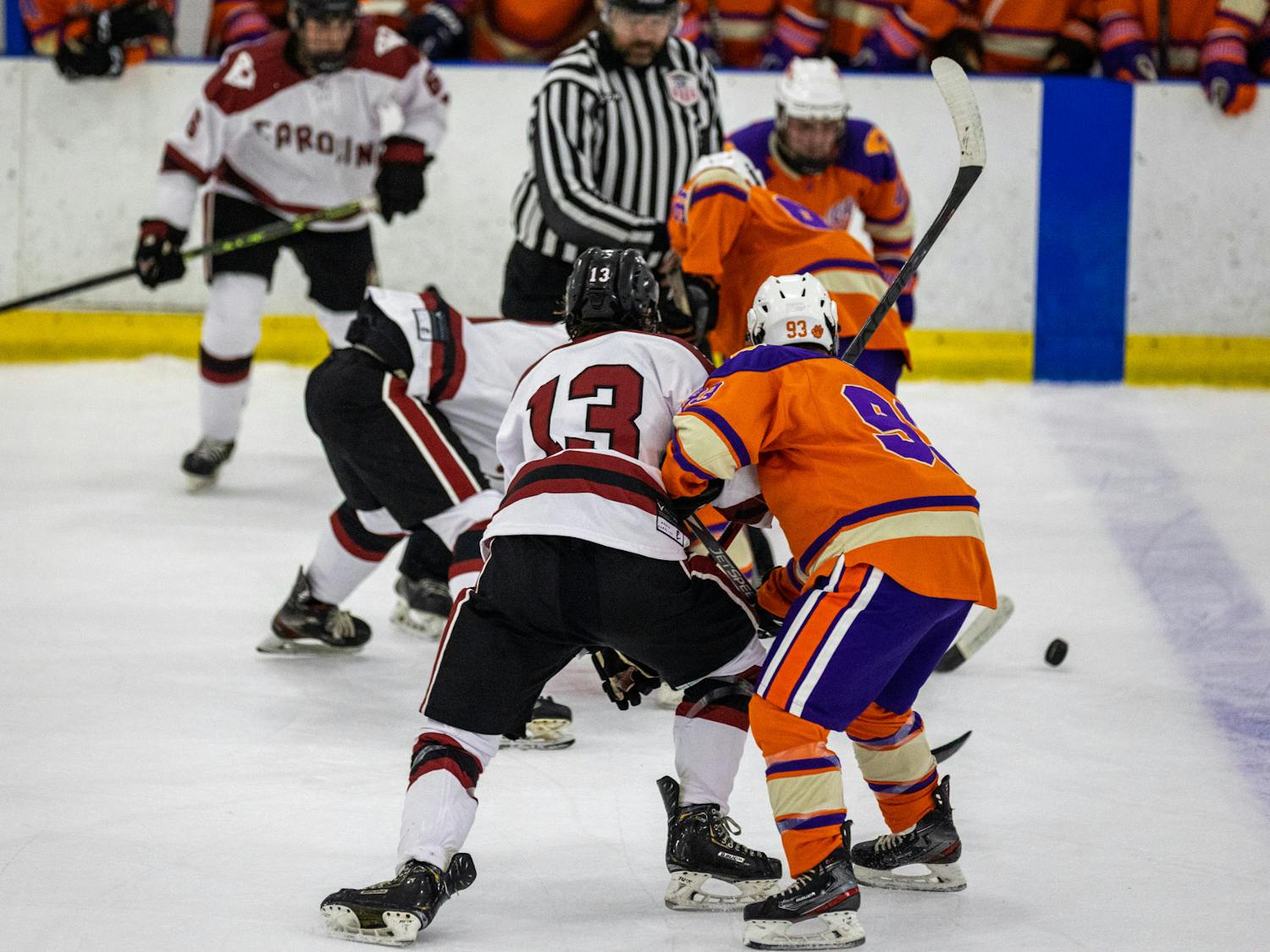 Senior center Owen Thomas battles against a Clemson opponent for the puck during a game against the Tigers on Nov. 11, 2022. South Carolina defeated Clemson 5-4 in an intense back and forth matchup.