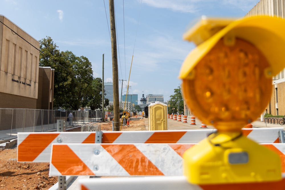 <p>Ongoing construction at the corner of South Main and Devine Streets closes two of the four lanes on South Main Street on Aug. 25, 2023. The South Main Street construction project plans to revitalize the sidewalks and crosswalks on the street in order to make the area more pedestrian-friendly.</p>