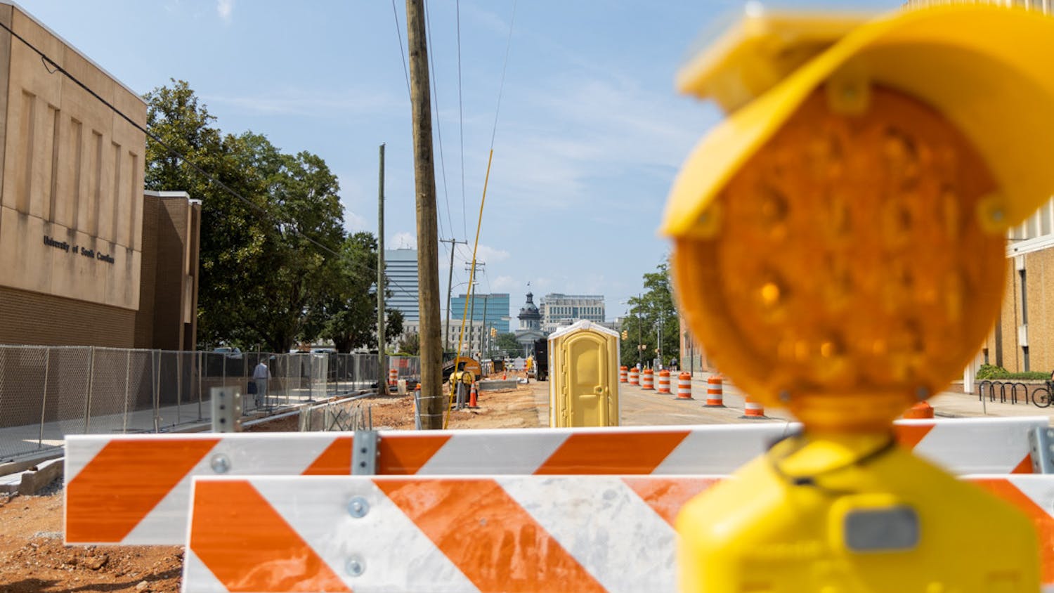Ongoing construction at the corner of South Main and Devine Streets closes two of the four lanes on South Main Street on Aug. 25, 2023. The South Main Street construction project plans to revitalize the sidewalks and crosswalks on the street in order to make the area more pedestrian-friendly.