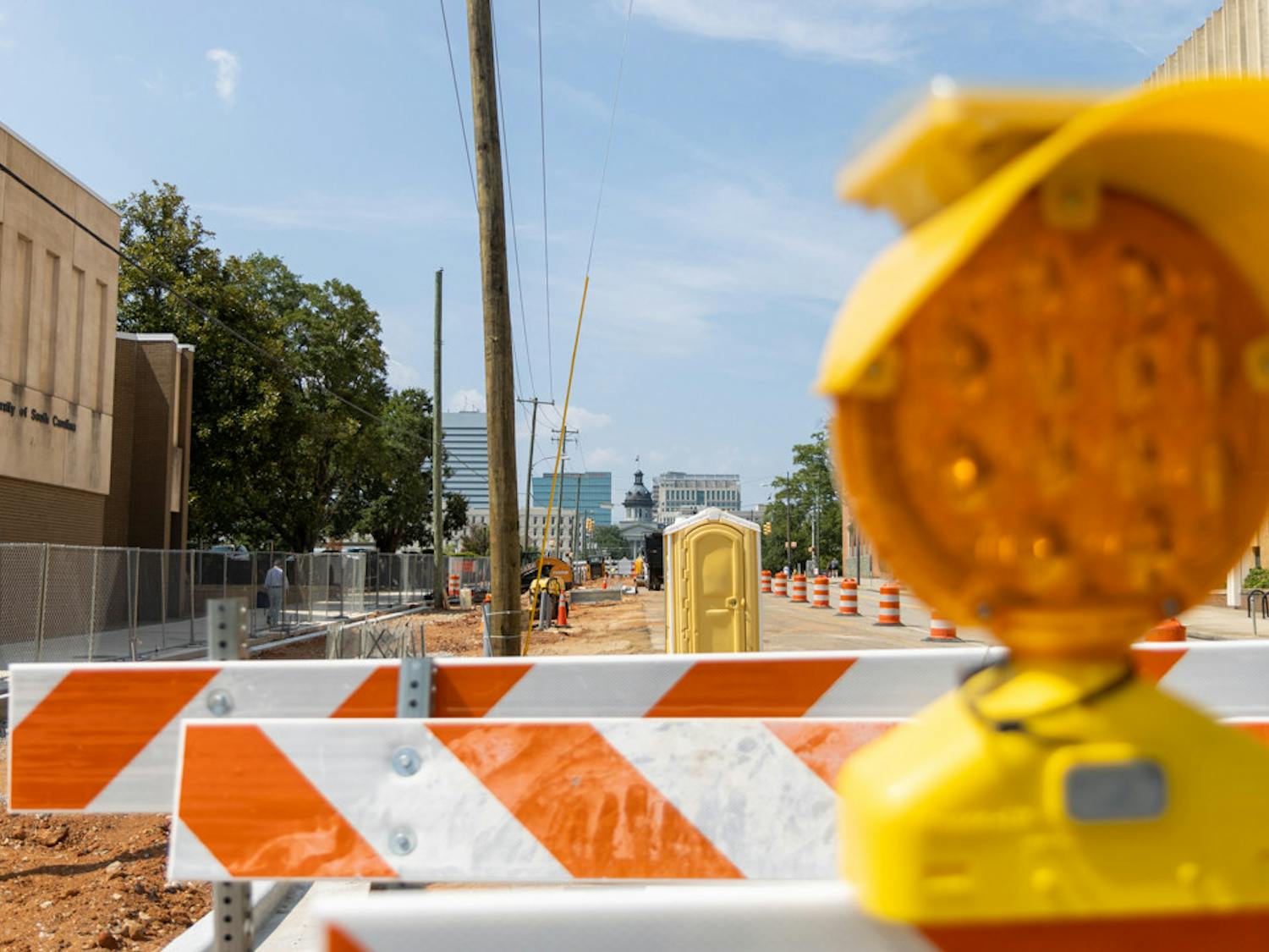 Ongoing construction at the corner of South Main and Devine Streets closes two of the four lanes on South Main Street on Aug. 25, 2023. The South Main Street construction project plans to revitalize the sidewalks and crosswalks on the street in order to make the area more pedestrian-friendly.