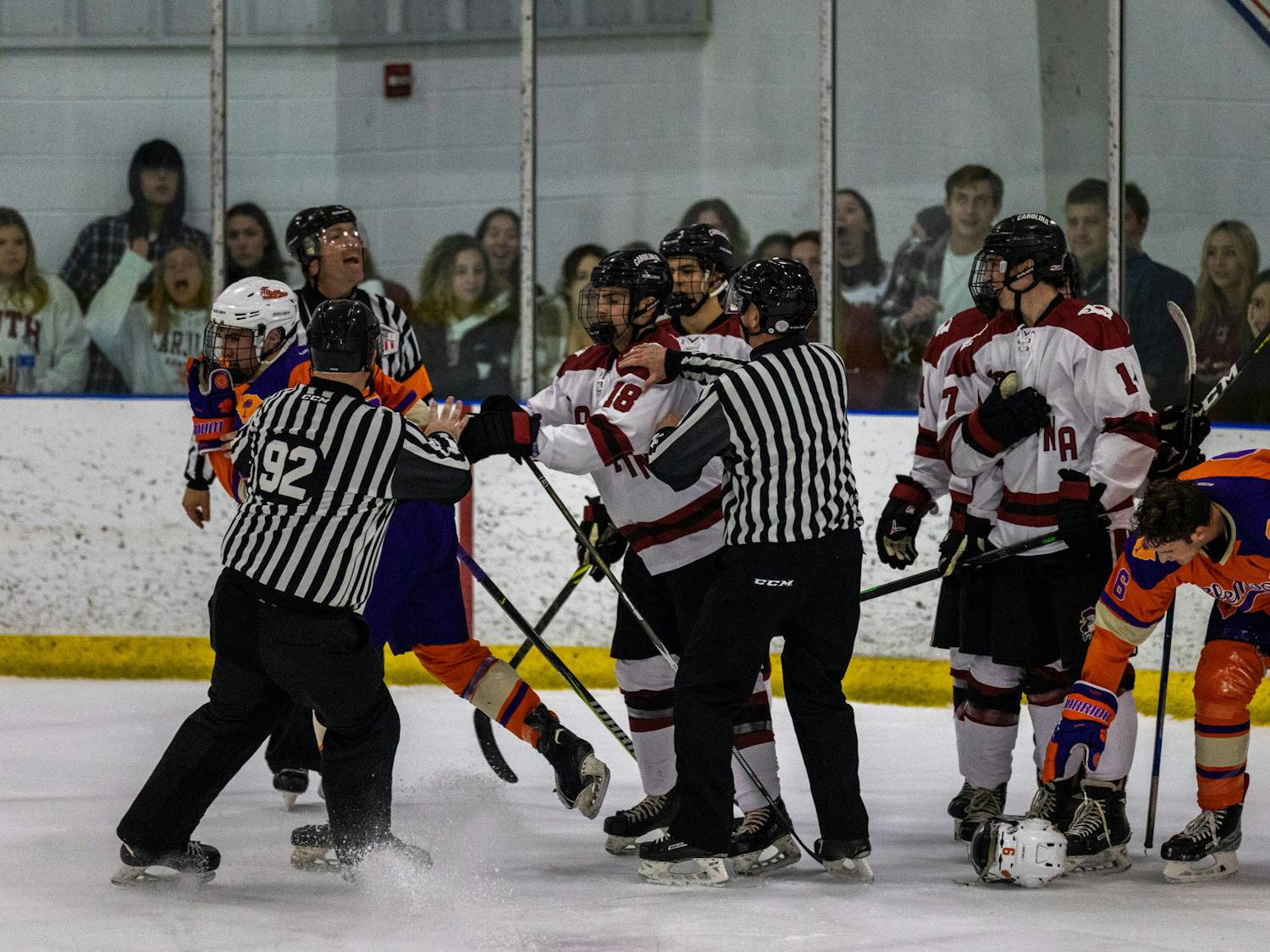 Senior winger Chad Lizine is pulled away from a Clemson opponent during a hockey match on Nov. 11, 2022. The brief scuffle is stopped early on by officials as the competition between the two South Carolina rivals heats up.