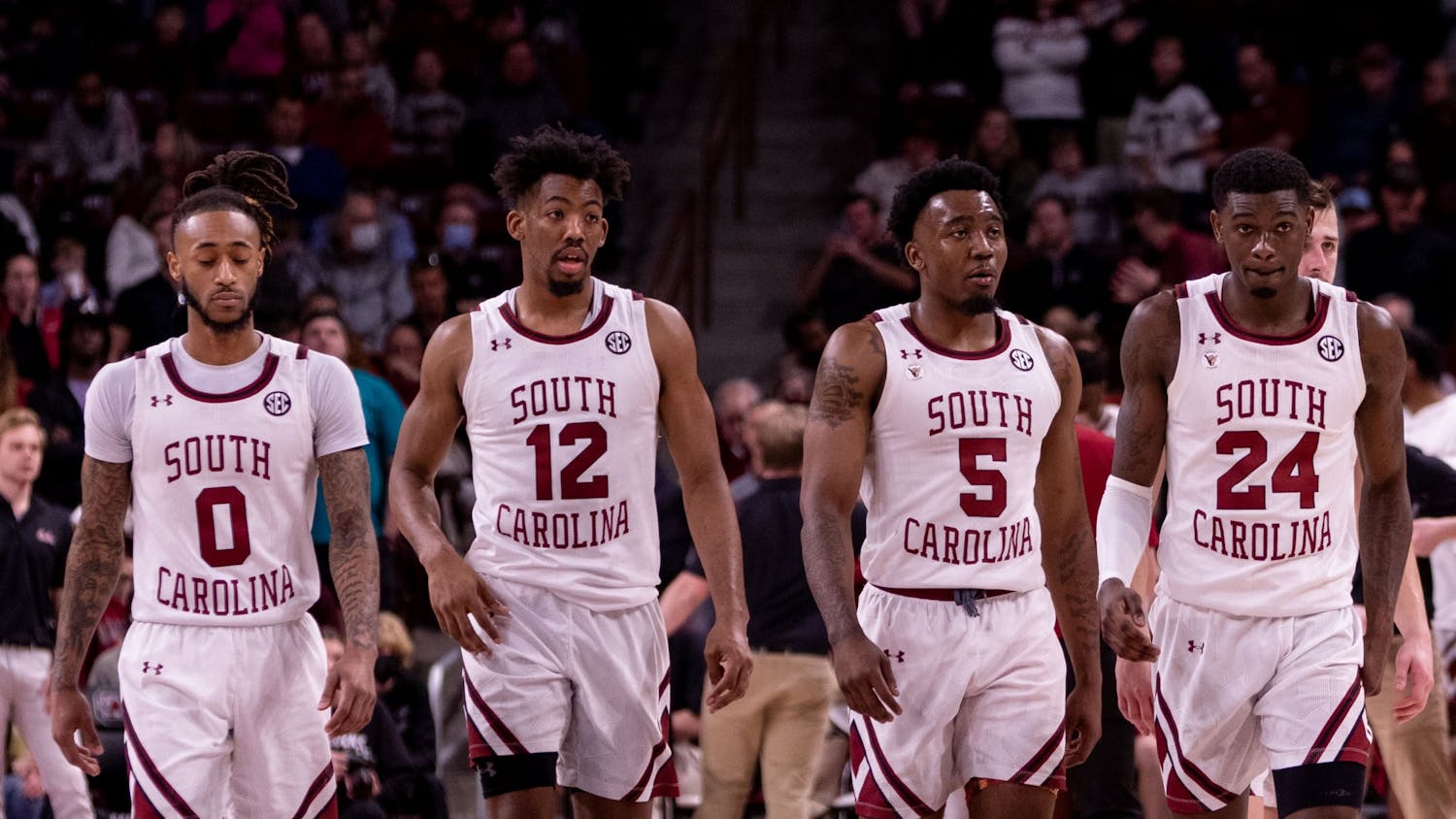 FILE— Members of the South Carolina men's basketball team walk down the court.