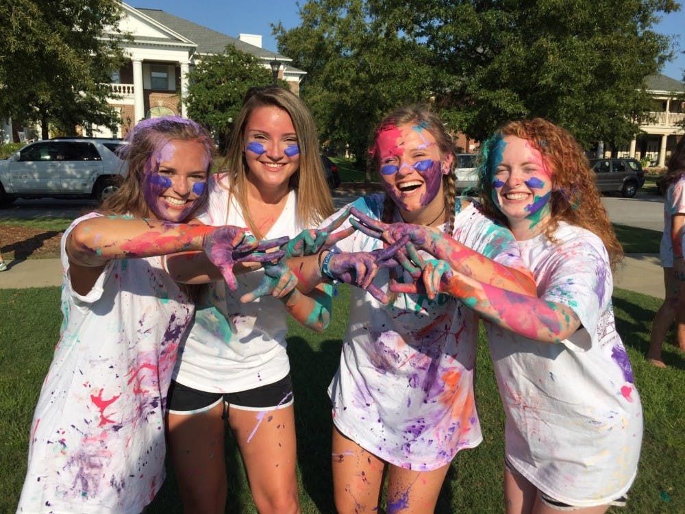Girls display the aftermath of a Paint War.&nbsp;