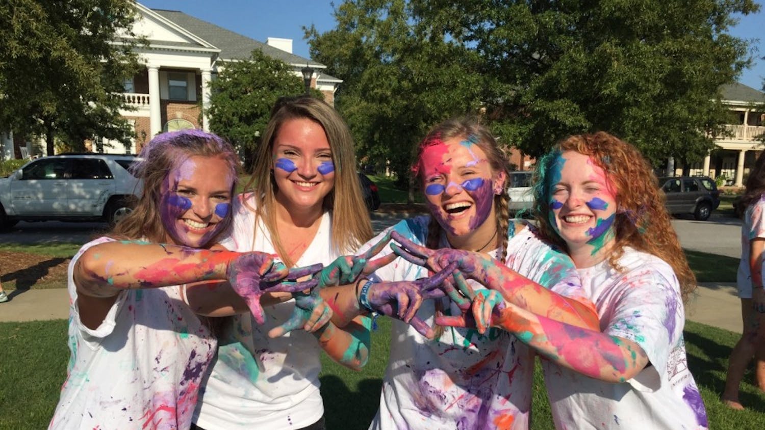 Girls display the aftermath of a Paint War.&nbsp;