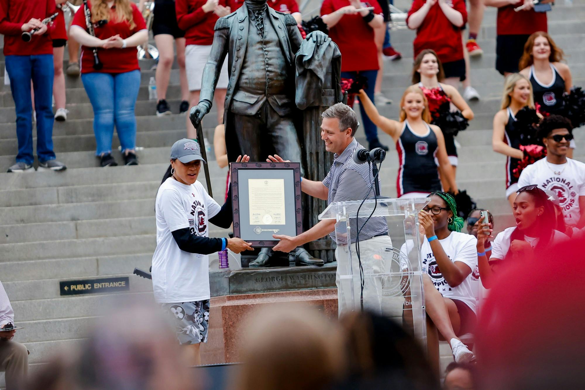 Congressman James E. Clyburn awards Women’s Basketball coach Dawn Staley with an award on April 13, 2022, after a parade in honor of the team’s national championship win. 