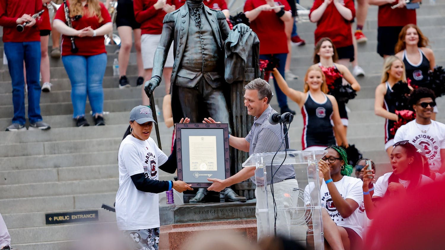 Congressman James E. Clyburn awards Women’s Basketball coach Dawn Staley with an award on April 13, 2022, after a parade in honor of the team’s national championship win. 