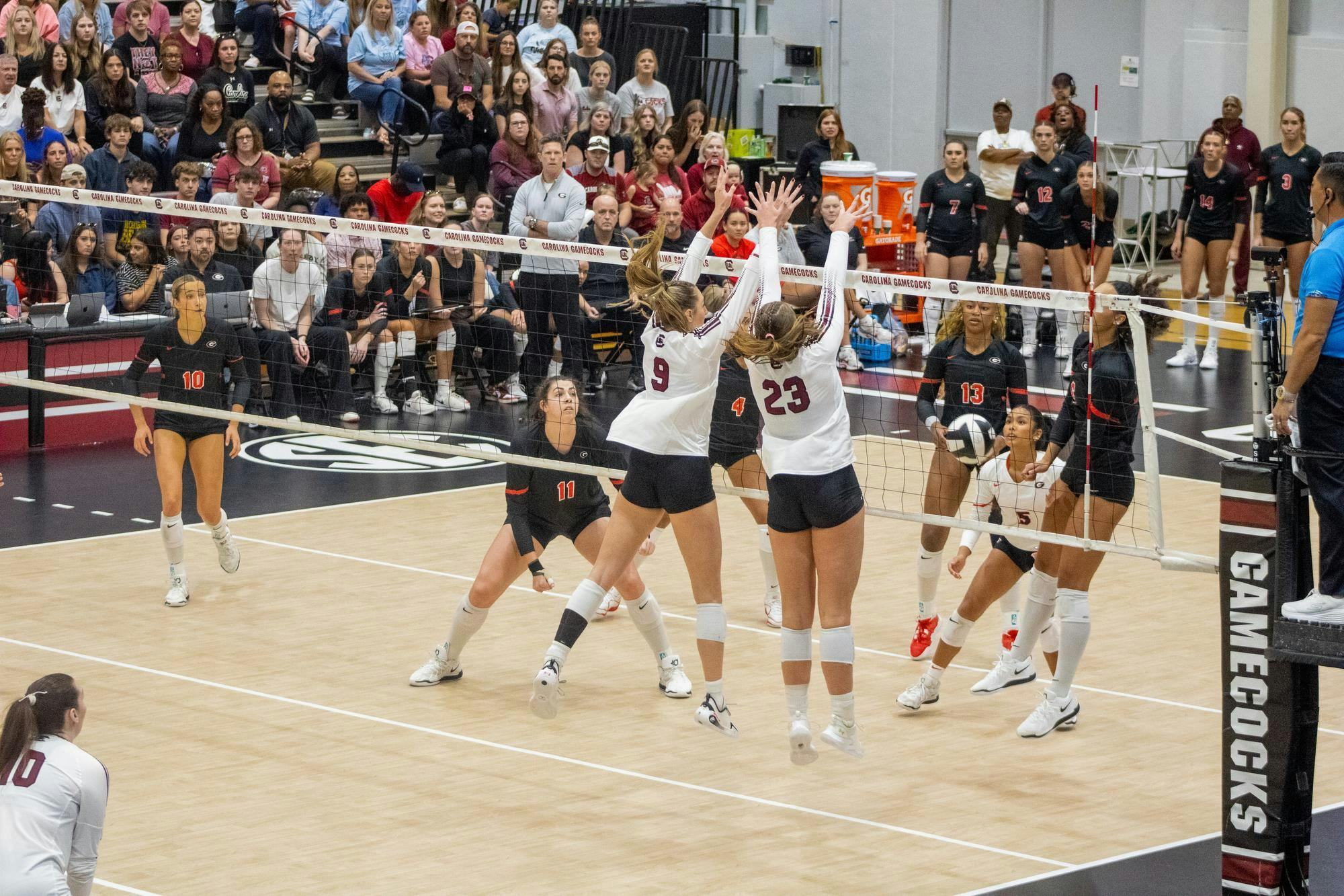 Sophomore right side hitter Elise Marchal and junior middle Ava Leahy jump to block the ball against the University of Georgia on Oct. 5, 2025, at the Carolina Volleyball Center. The Gamecocks have a total of 104 blocks so far over the course of the 2025 season.