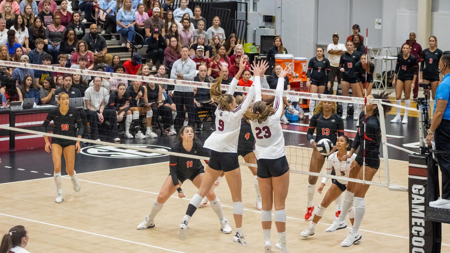 Sophomore right side hitter Elise Marchal and junior middle Ava Leahy jump to block the ball against the University of Georgia on Oct. 5, 2025, at the Carolina Volleyball Center. The Gamecocks have a total of 104 blocks so far over the course of the 2025 season.