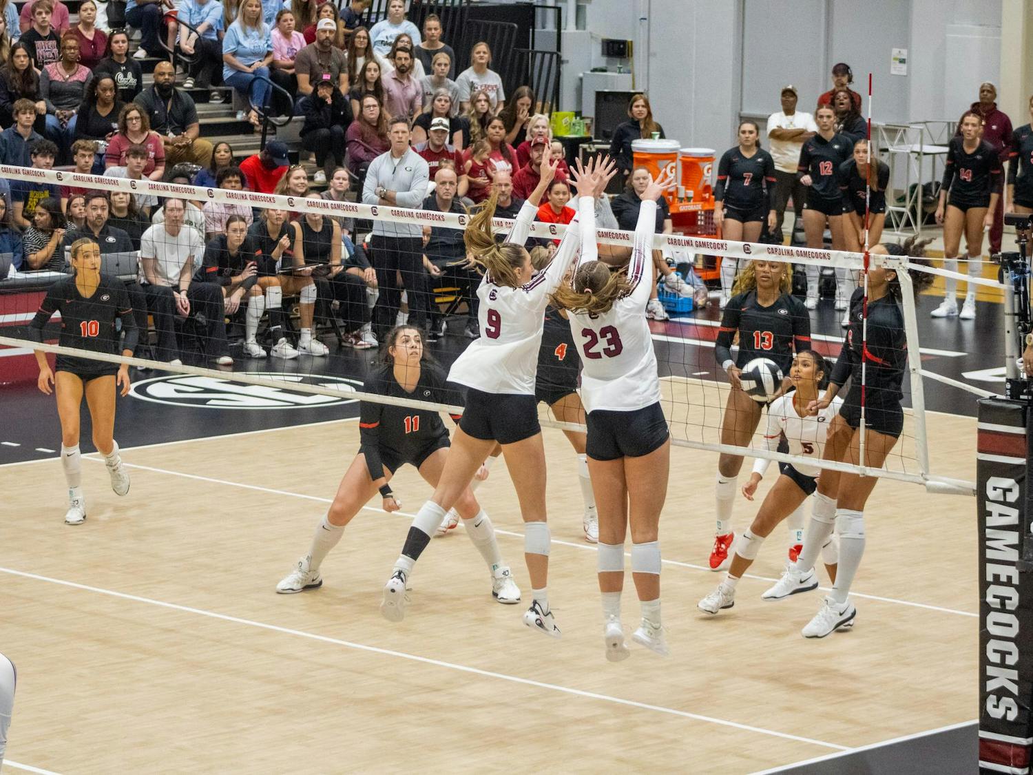 Sophomore right side hitter Elise Marchal and junior middle Ava Leahy jump to block the ball against the University of Georgia on Oct. 5, 2025, at the Carolina Volleyball Center. The Gamecocks have a total of 104 blocks so far over the course of the 2025 season.