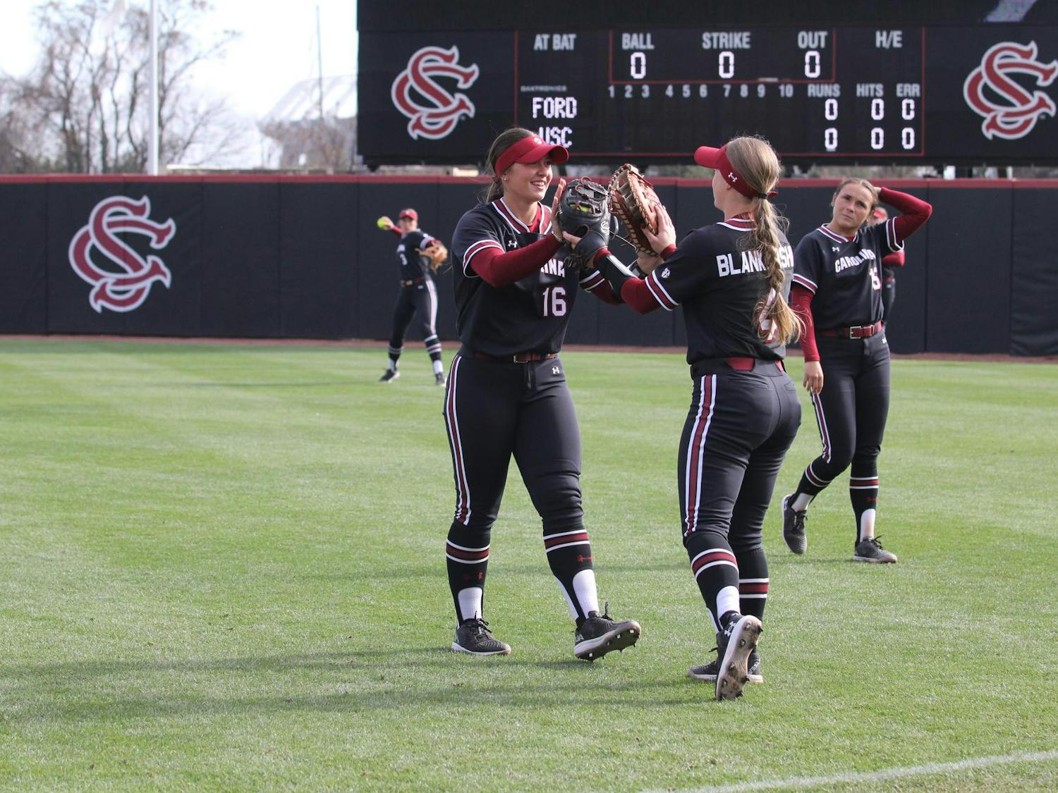 Junior infielder Arianna Rodi and senior infielder Brook Blankenship high five as they conclude their warmup in pregame against Fordham on Feb. 22, 2025, at Beckham Field. Blankenship’s two-run single up the middle ended the game.