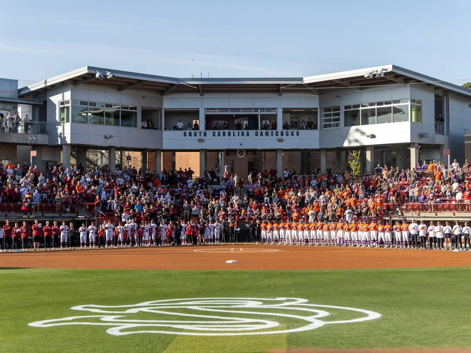 FILE — South Carolina softball players, coaches and fans stand during the playing of the national anthem at Carolina Softball Stadium on March 25, 2025. The Gamecocks are 32-10 (7-8 SEC) on the season after losing a series to Arkansas on April 13.