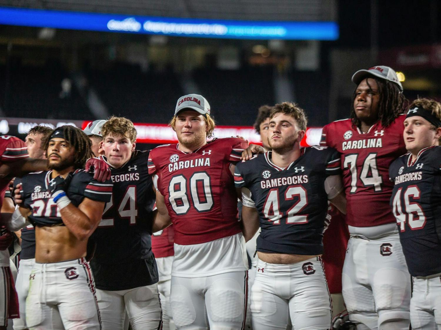 Members of the South Carolina football team gather in front of the Carolina Band for the alma mater following the 2024 Garnet &amp; Black Spring Game at Williams-Brice Stadium on April 20. The Garnet team defeated the Black team 17-0.