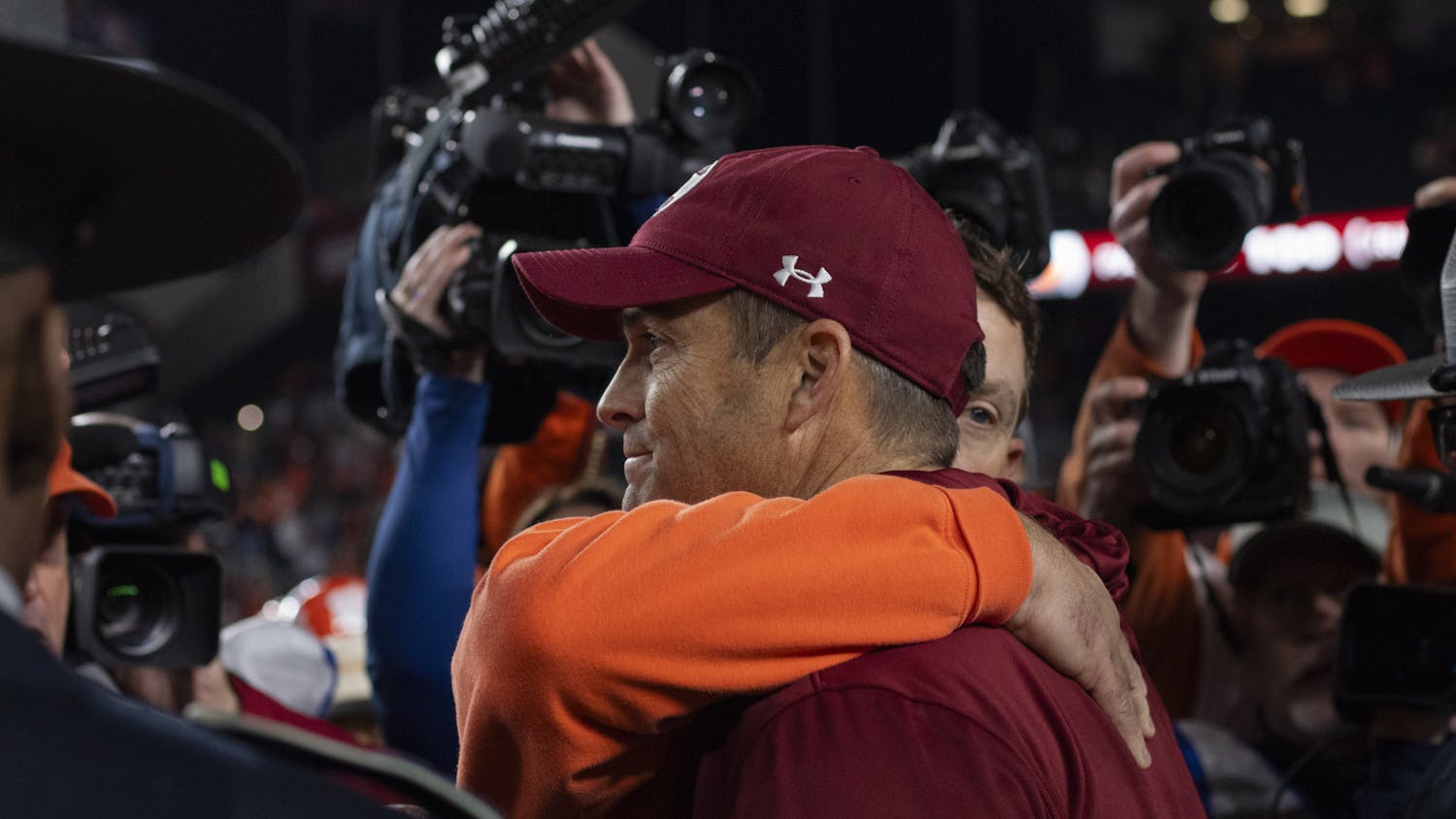 Clemson University head coach Dabo Swinney hugs University of South Carolina head coach Shane Beamer after a 16-7 Tiger victory over the Gamecocks at Williams-Brice Stadium on Nov. 25, 2023. The 121st Palmetto Bowl will return to Clemson in 2024.