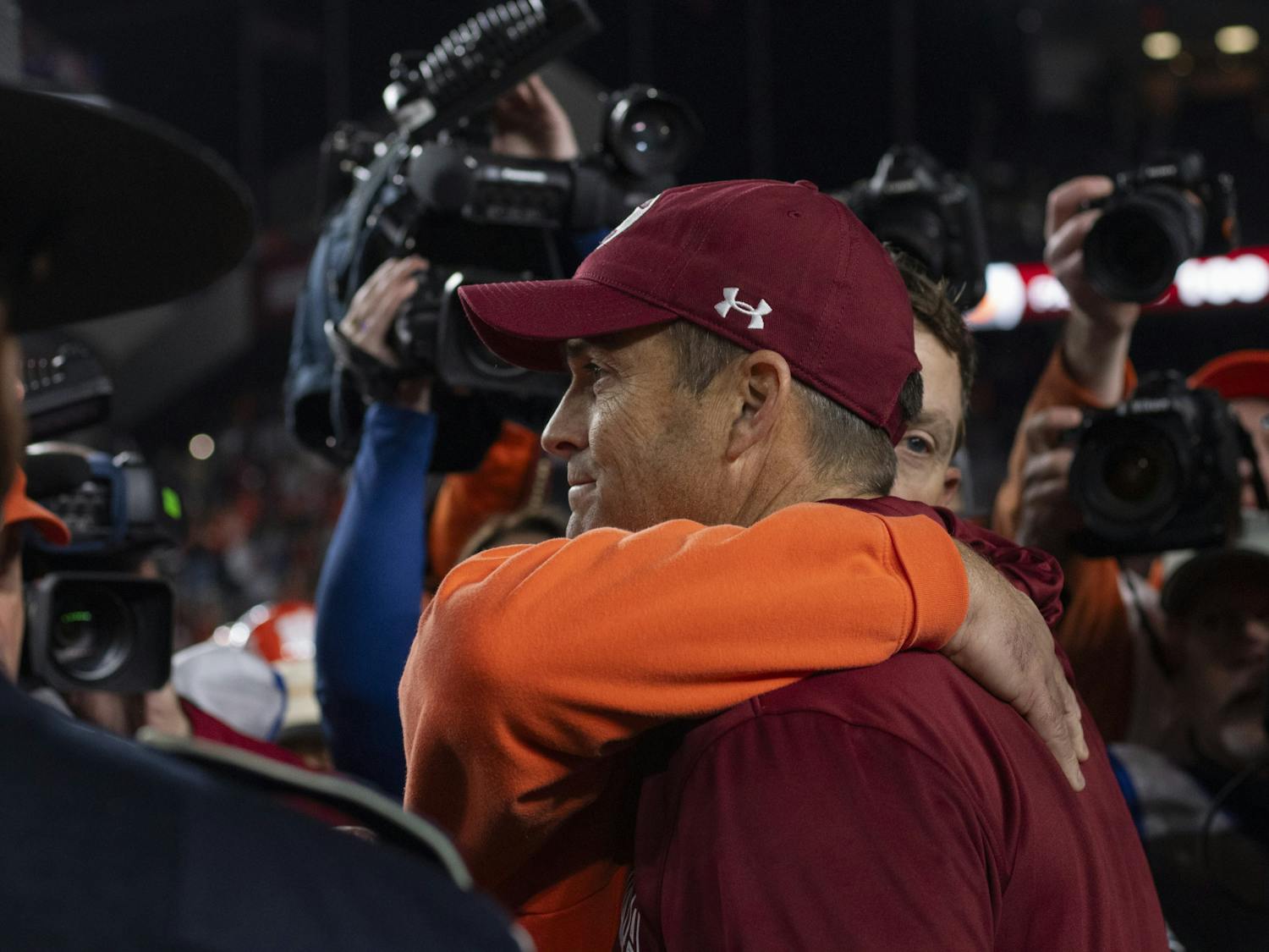 Clemson University head coach Dabo Swinney hugs University of South Carolina head coach Shane Beamer after a 16-7 Tiger victory over the Gamecocks at Williams-Brice Stadium on Nov. 25, 2023. The 121st Palmetto Bowl will return to Clemson in 2024.