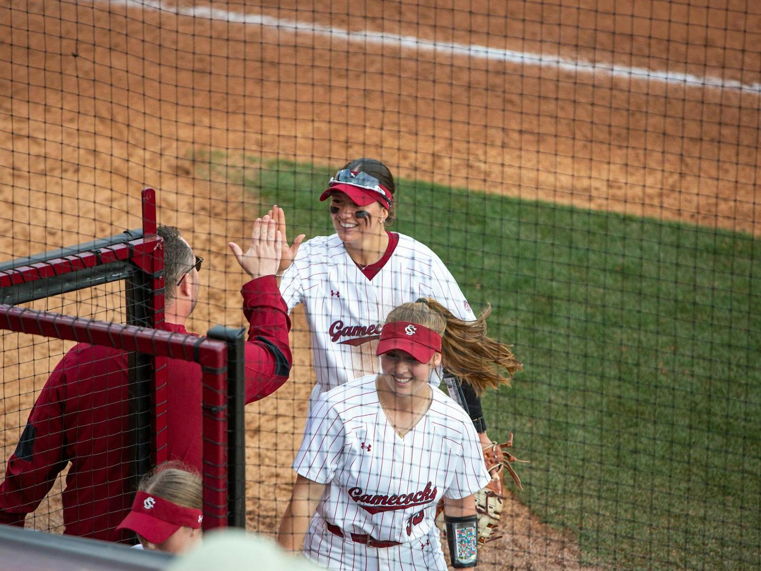 Gamecock softball players return to the dugout at Beckham Field after closing out the inning against Providence on Feb. 8, 2025. This was one of five games the Gamecocks played as a part of the Gamecock Invitational.