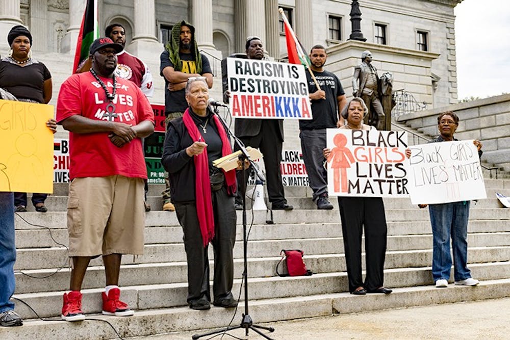 <p>Protesters gather on the State House steps to demand change in local police departments.</p>