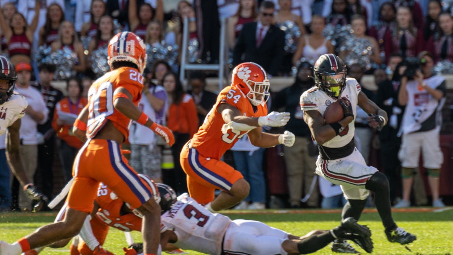 Junior tight end Jaheim Bell breaks away from Clemson's defense while carrying the ball toward the end zone on Nov. 26, 2022, at Memorial Stadium. Bell rushed nine times against Clemson.