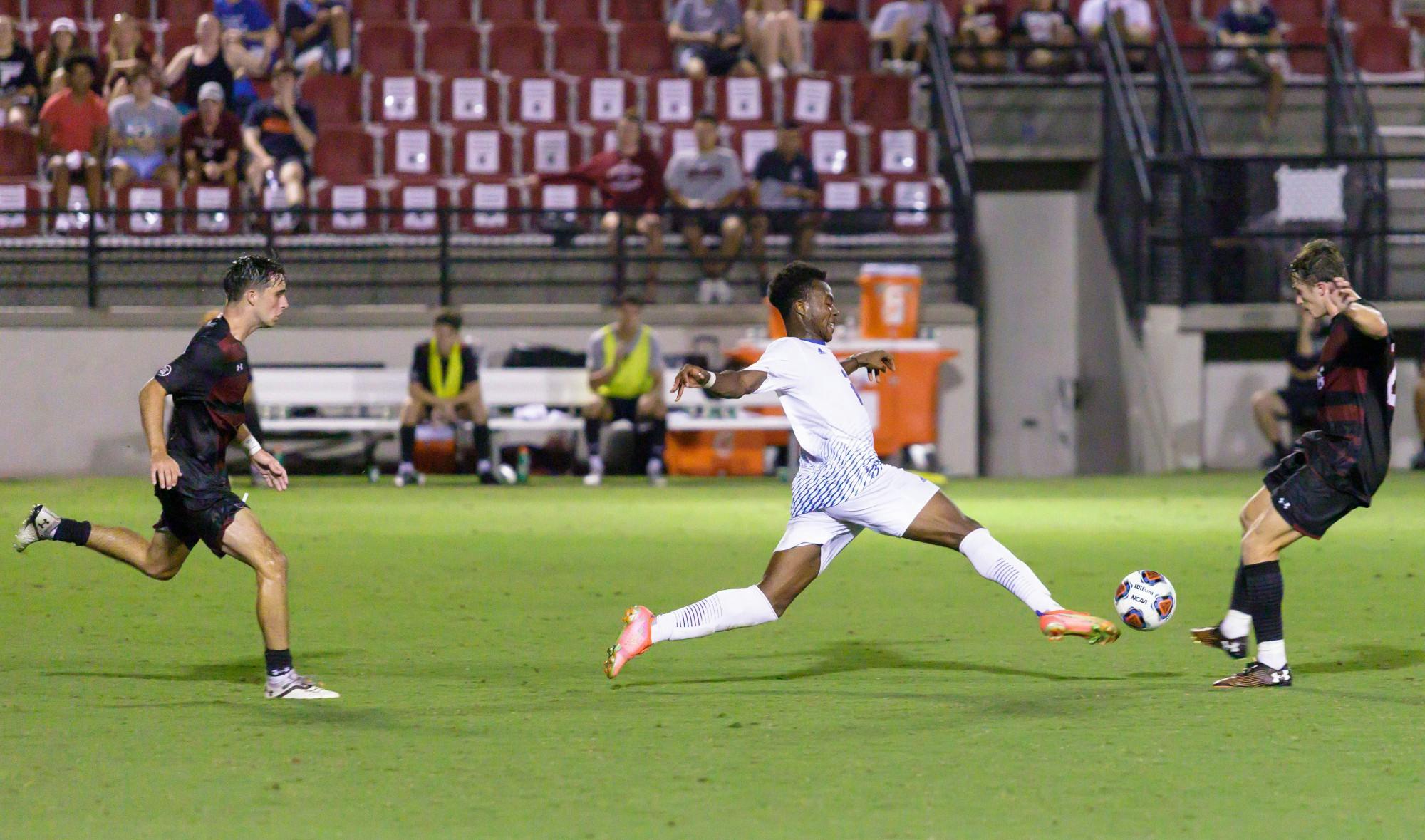 Presbyterian Sophmore Daniel Anani (forward) kicks the ball. 