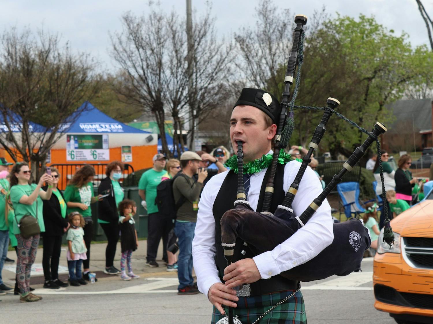 A bagpiper plays the bagpipes in the 40th Annual St. Pats in 5 Points Parade on March 19, 2022.