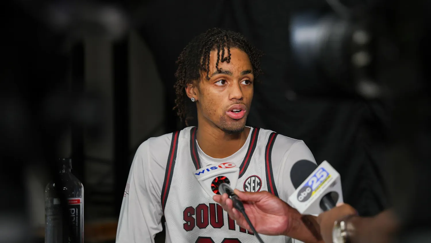 FILE – Freshman guard Cam Scott talks to reporters after a team practice on Oct. 21, 2024 at Colonial Life Arena. Scott, the top player in South Carolina in his recruiting class, averaged 22 points and 6.4 rebounds per game in his senior year of high school.