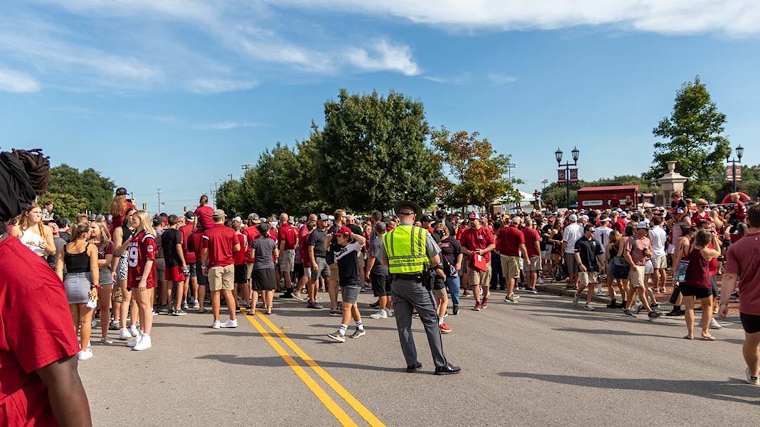 FILE — Gamecock fans lined up for the Gamecock Walk through Gamecock Park to Williams-Brice Stadium on Sept. 5, 2021. Gamecock Walk stretches across Bluff Rd and requires it to be temporarily shut down by local law enforcement.