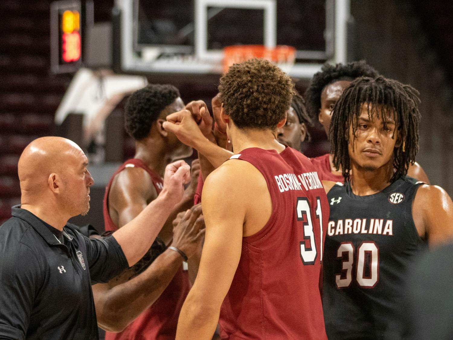 The Gamecocks huddle up before an intrasquad scrimmage on Oct. 26, 2022. The men's basketball team hosted the Garnet &amp; Black Madness event to prepare for the upcoming season.
