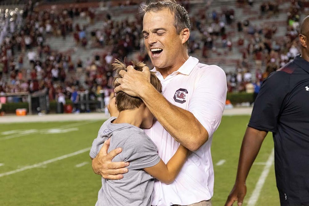 FILE — Head football coach Shane Beamer celebrates with family after his first win with the Gamecocks over Eastern Illinois at Williams-Brice Stadium on Sept. 4, 2021. The Gamecocks beat Eastern Illinois 46-0.