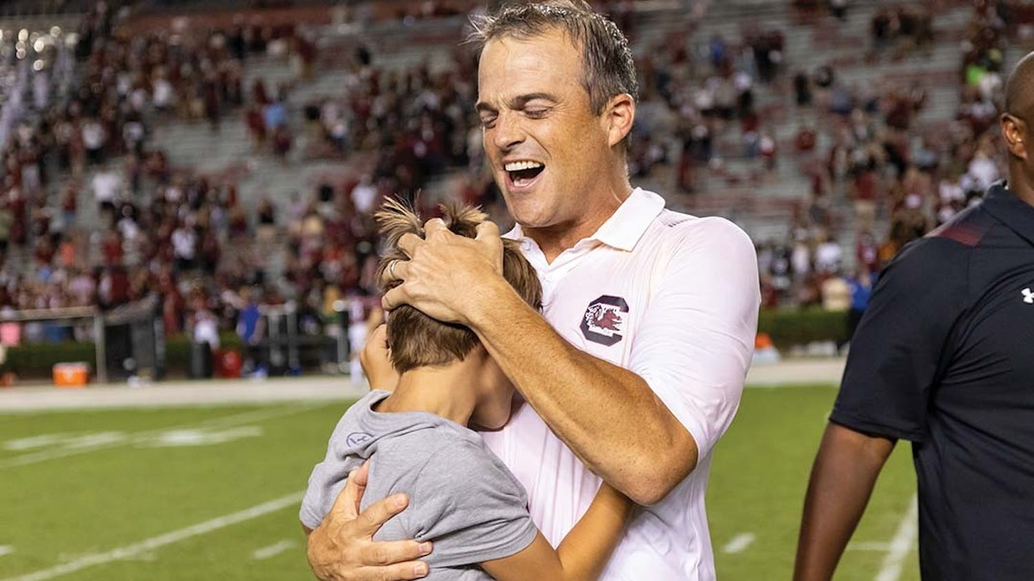 FILE — Head football coach Shane Beamer celebrates with family after his first win with the Gamecocks over Eastern Illinois at Williams-Brice Stadium on Sept. 4, 2021. The Gamecocks beat Eastern Illinois 46-0.