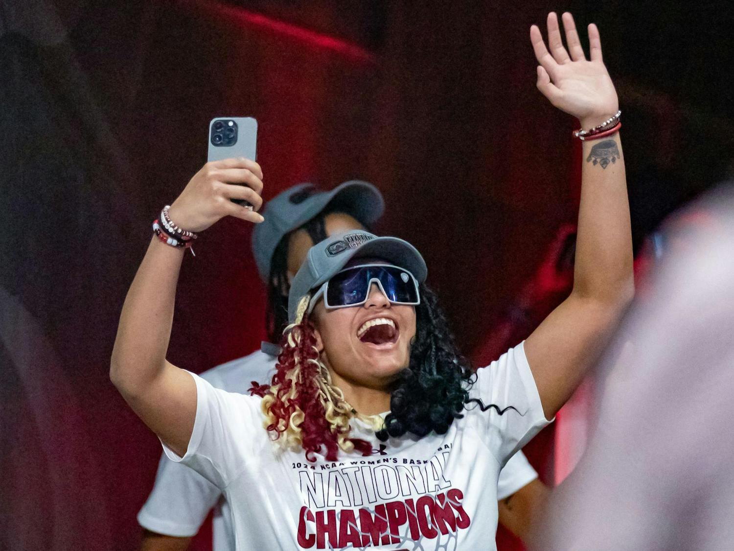Senior guard Te-Hina Paopao waves to fans as she and her teammates arrive during a welcome home celebration for the South Carolina women's basketball team at Colonial Life Arena on April 8, 2024. Paopao was responsible for 14 points in 22 minutes of playing time during the Gamecocks' 87-75 victory over the Iowa Hawkeyes.