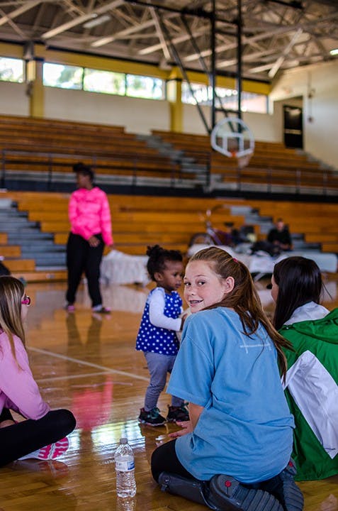 Volunteers play with children at Lower Richland High School Red Cross shelter on October 6.