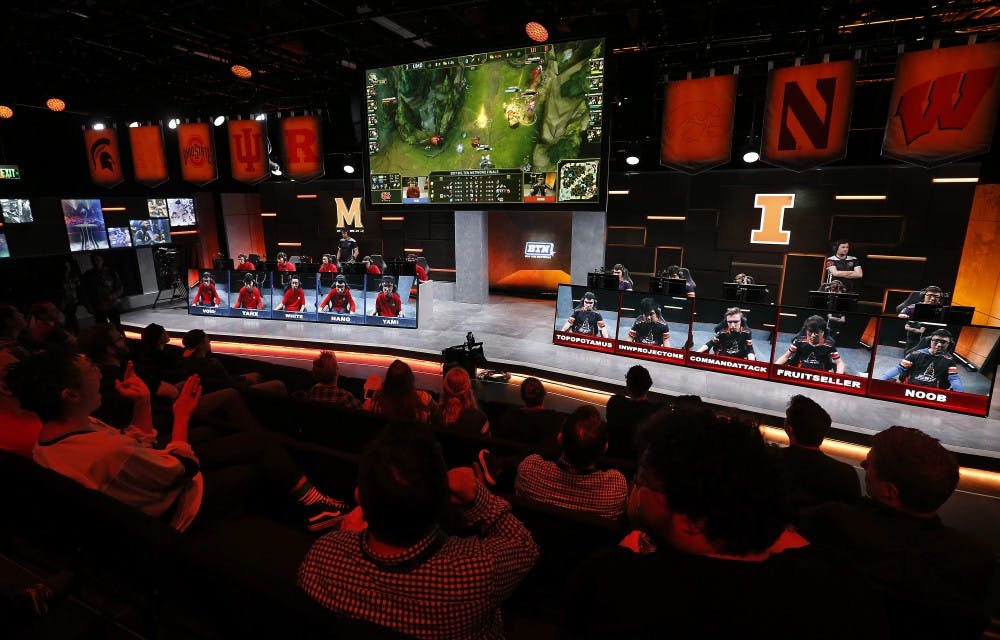 The audience watches a match between the University of Maryland, left, and the University of Illinois in the Big Ten Network "League of Legends" championship in the Battle Theater at North American League Championship Arena at Riot Games in Los Angeles on March 28, 2017.  Maryland won the best of five contest by a score of 3-0. (Mel Melcon/Los Angeles Times/TNS) 