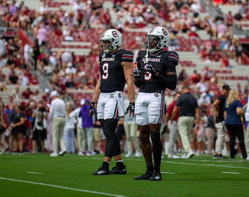 <p>Freshman wide receiver Mazeo Bennett Jr. and redshirt senior Luke Doty stand on the field for pregame warmups at Williams Brice Stadium on Sept. 14, 2024. Bennett, a true freshman, has shocked the fans by earning himself a spot on the starting roster.</p>