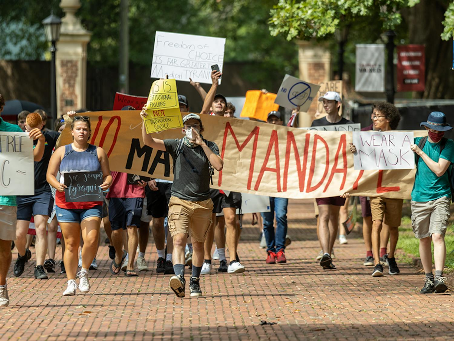 The USC Turning Point USA chapter protests on the Horseshoe over the mask mandate while the Carolina Socialists counterprotest. The mask mandate was put in place by interim university President Harris Pastides on Aug. 18, 2021.
