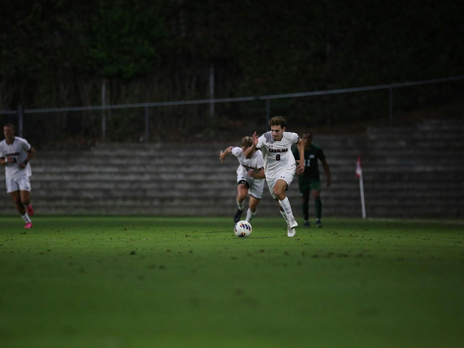 Sophomore midfielder Ethan Dekel Daks sprints while dribbling the ball to pass it to a teammate downfield on Oct. 3, 2023. Daks has scored 2 goals for the Gamecocks so far this season.