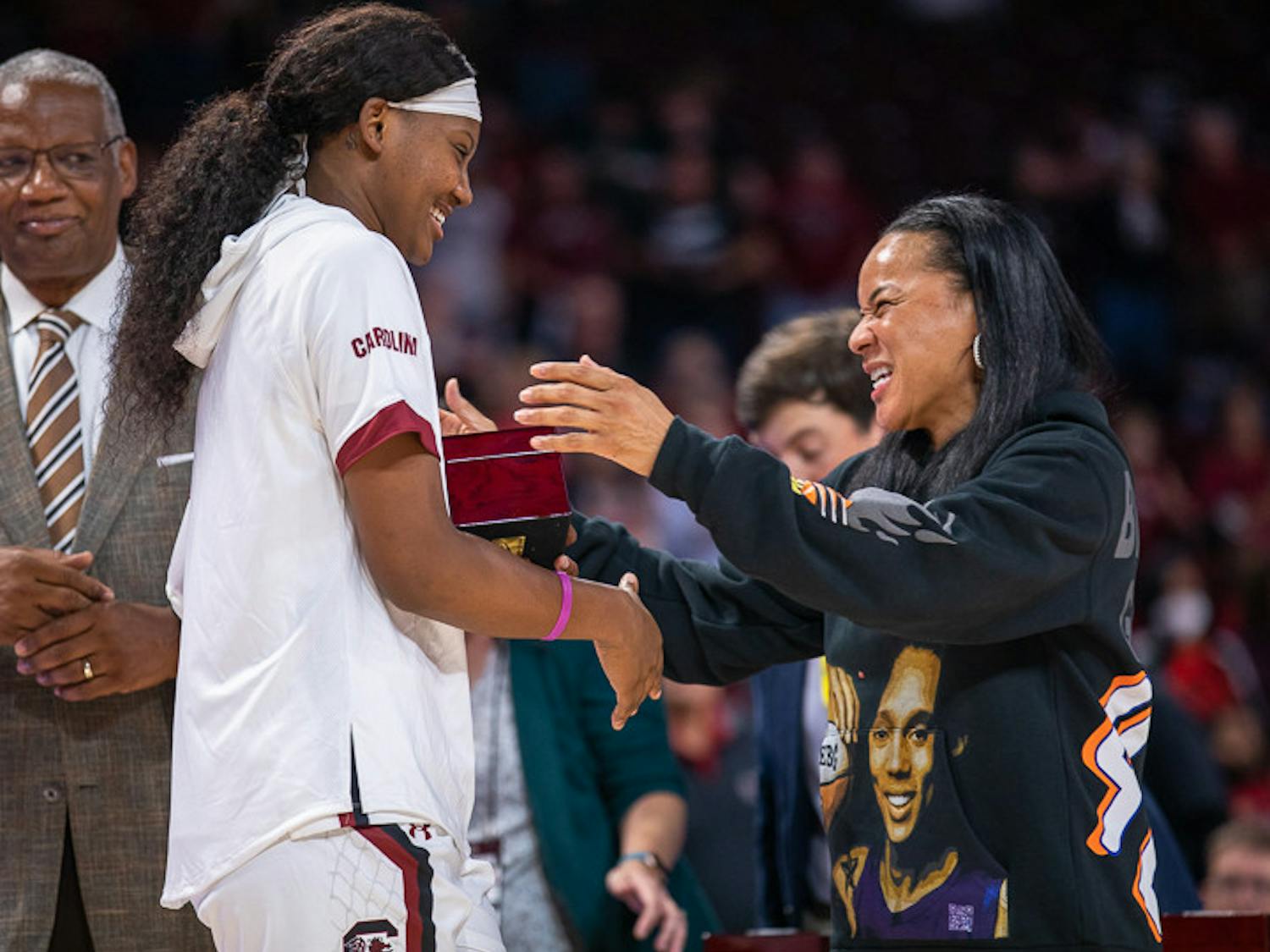 Sophomore forward Sania Feagin (left) and head coach Dawn Staley (right) laugh together after Staley gives Feagin her national championship ring. South Carolina played East Tennessee State on Nov. 7, 2022. The Gamecocks beat the Buccaneers 101- 31.
