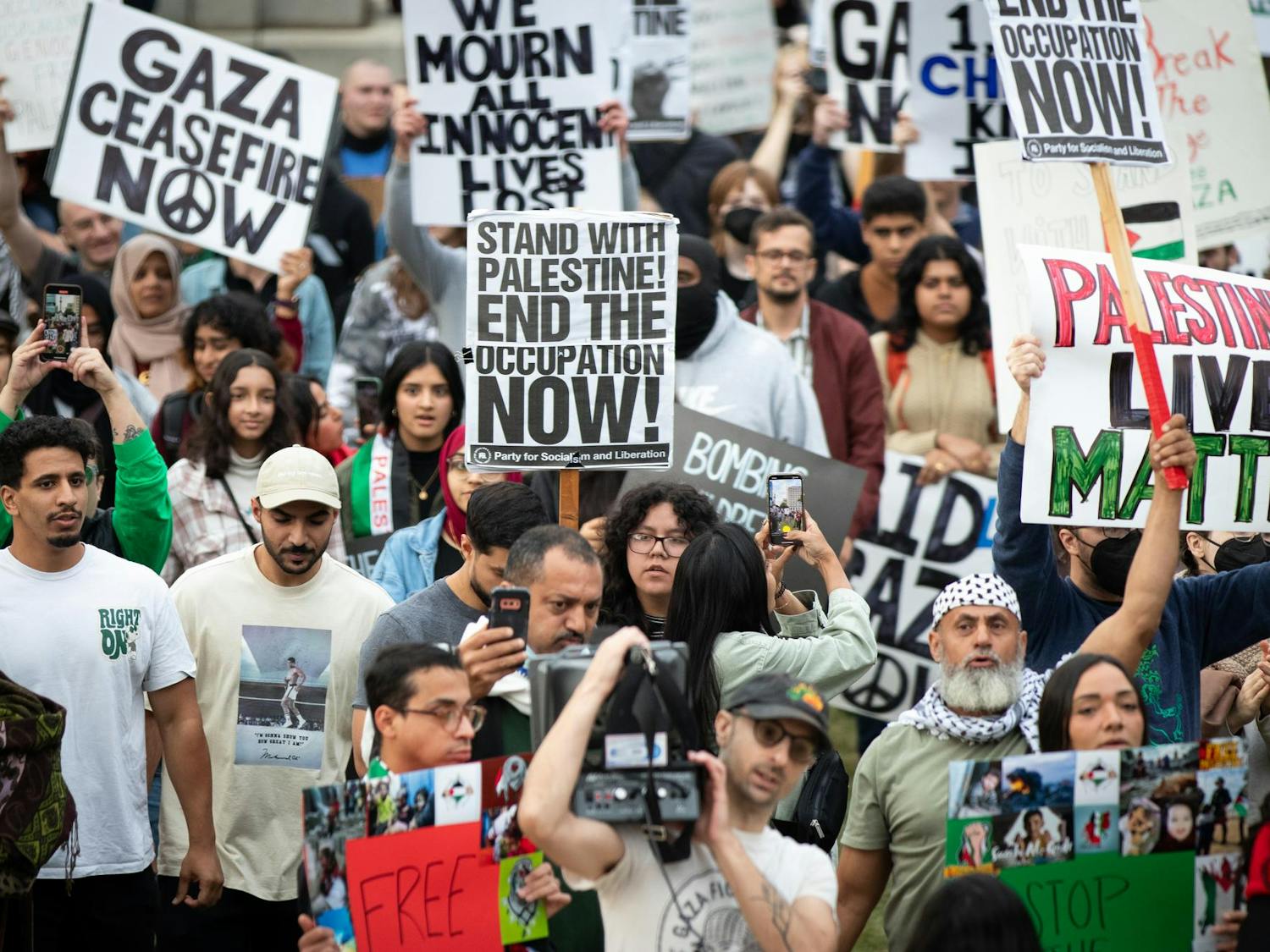 Attendees of the Free Palestine rally in Columbia, S.C., follow organizers of the event in a march around the Statehouse. The rally was held by the North and South Carolina Party for Social Liberation on Oct. 17, 2023.