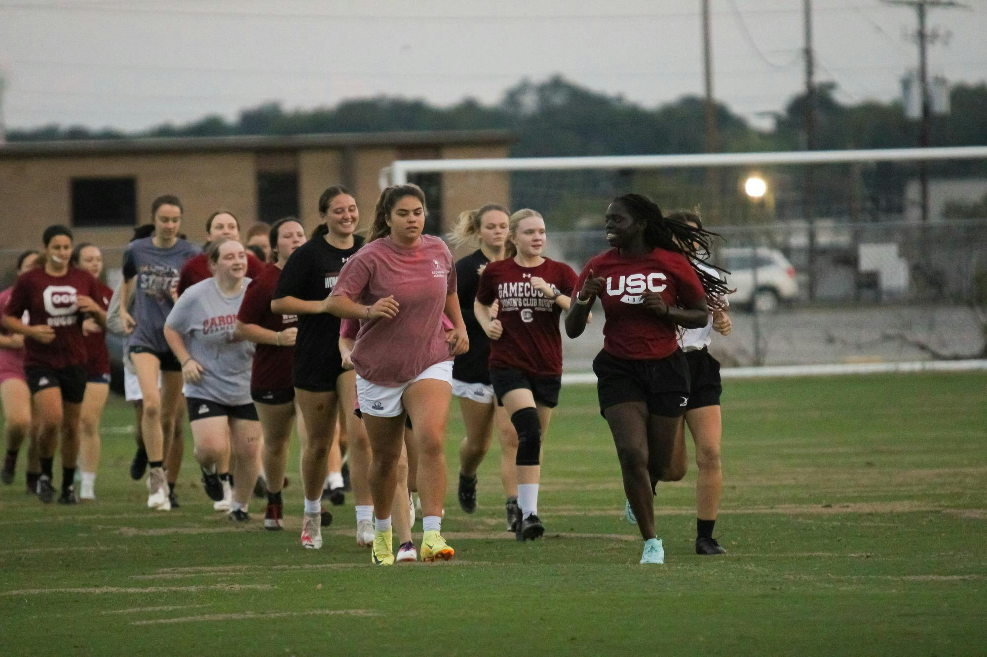 The University of South Carolina’s Women's Club Rugby team warms up for their practice at 1101 Bluff Road on Sept. 30, 2024. President Parks Elkins oversees running the drills at the beginning of practice.