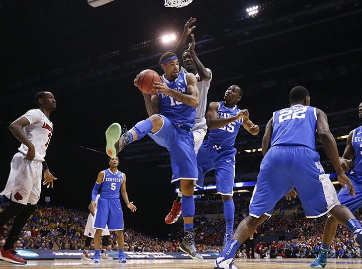 Kentucky&apos;s Willie Cauley-Stein (15) pulls down a rebound against Louisville in the NCAA Tournament&apos;s Midwest Region semifinal at Lucas Oil Stadium in Indianapolis on Friday, March 28, 2014. (Mark Cornelison/Lexington Herald-Leader/MCT)