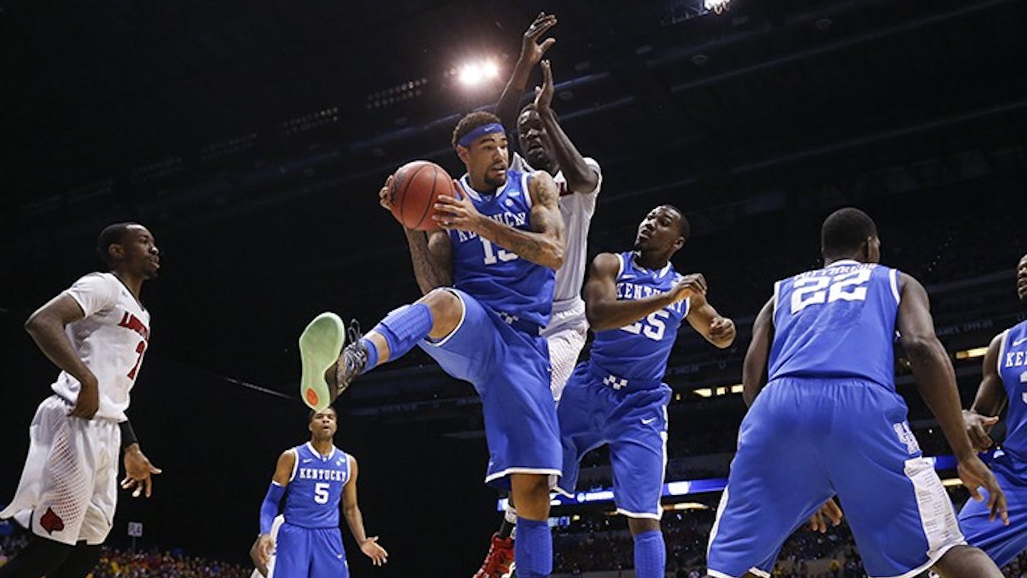 Kentucky&apos;s Willie Cauley-Stein (15) pulls down a rebound against Louisville in the NCAA Tournament&apos;s Midwest Region semifinal at Lucas Oil Stadium in Indianapolis on Friday, March 28, 2014. (Mark Cornelison/Lexington Herald-Leader/MCT)
