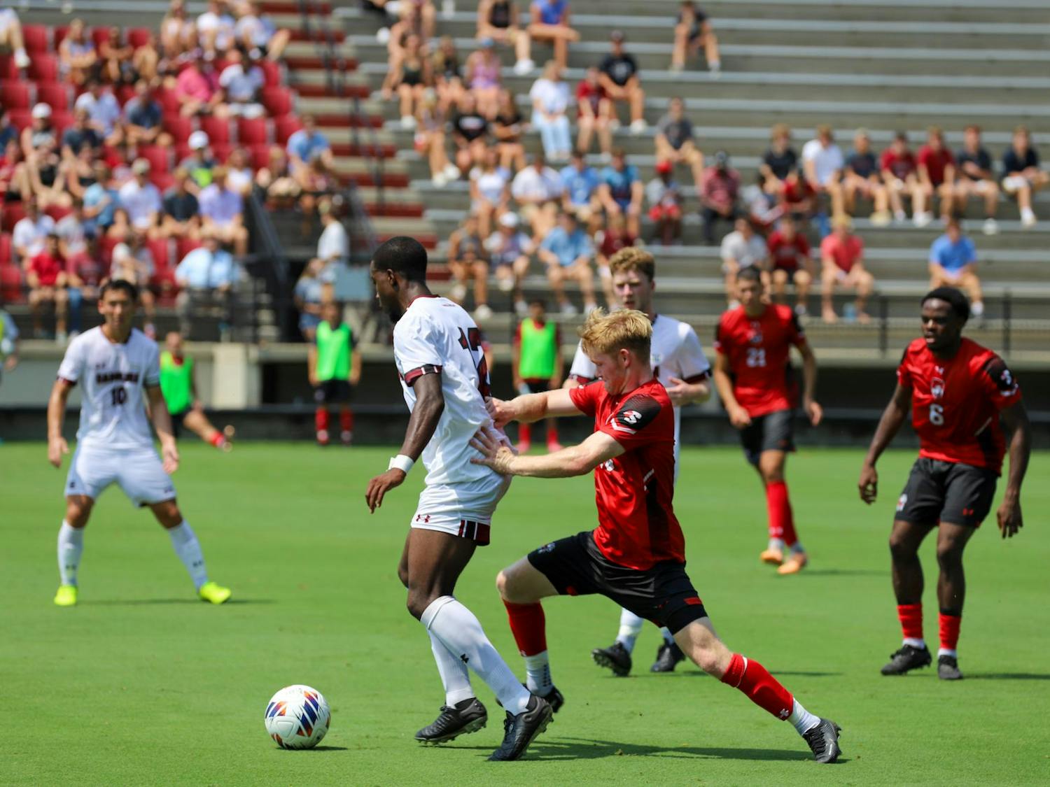 Senior defender Jaiden Ramsay-Kelly shields the ball from Gardner-Webb players while he looks for a teammate to set up a pass. The Gamecocks fell to the Bulldogs 2-0 in its first home game.