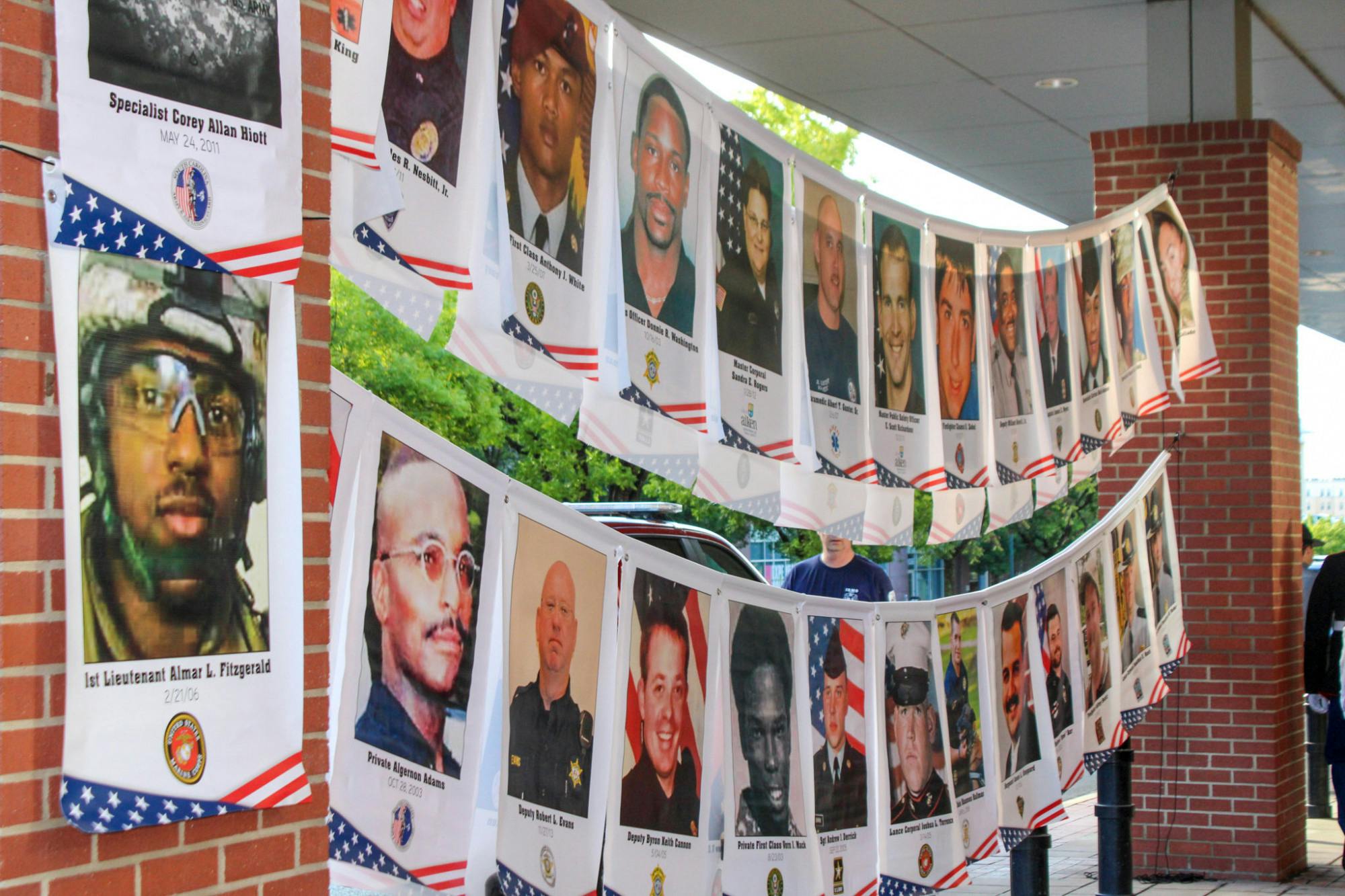 A display showing a few of the veterans and service members who lost their lives in relation to 9/11 at the remembrance ceremony on Sept. 11, 2022 at the Columbia Metropolitan Convention Center. The 9/11 Remembrance Foundation of South Carolina invited guests and veterans to speak in memoriam of the lives lost in relation to the tragedy.
