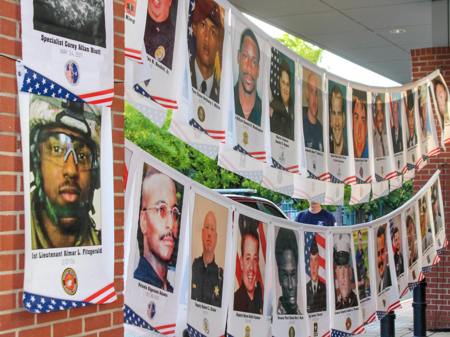 A display showing a few of the veterans and service members who lost their lives in relation to 9/11 at the remembrance ceremony on Sept. 11, 2022 at the Columbia Metropolitan Convention Center. The 9/11 Remembrance Foundation of South Carolina invited guests and veterans to speak in memoriam of the lives lost in relation to the tragedy.