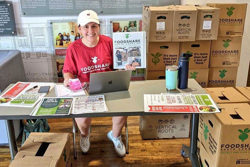 Fourth-year exercise science student Sophie Crosby distributes FoodShare boxes in Hamilton College on Wednesday, Feb. 23, 2022. FoodShare is a program initiated by the USC School of Medicine to increase access to fresh food across the state.