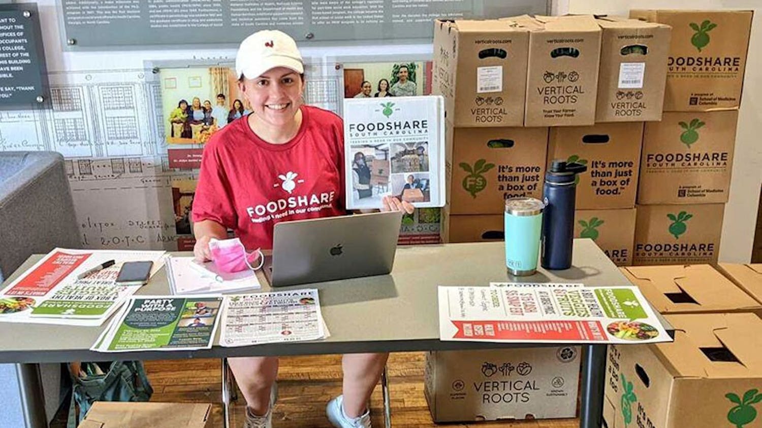 Fourth-year exercise science student Sophie Crosby distributes FoodShare boxes in Hamilton College on Wednesday, Feb. 23, 2022. FoodShare is a program initiated by the USC School of Medicine to increase access to fresh food across the state.