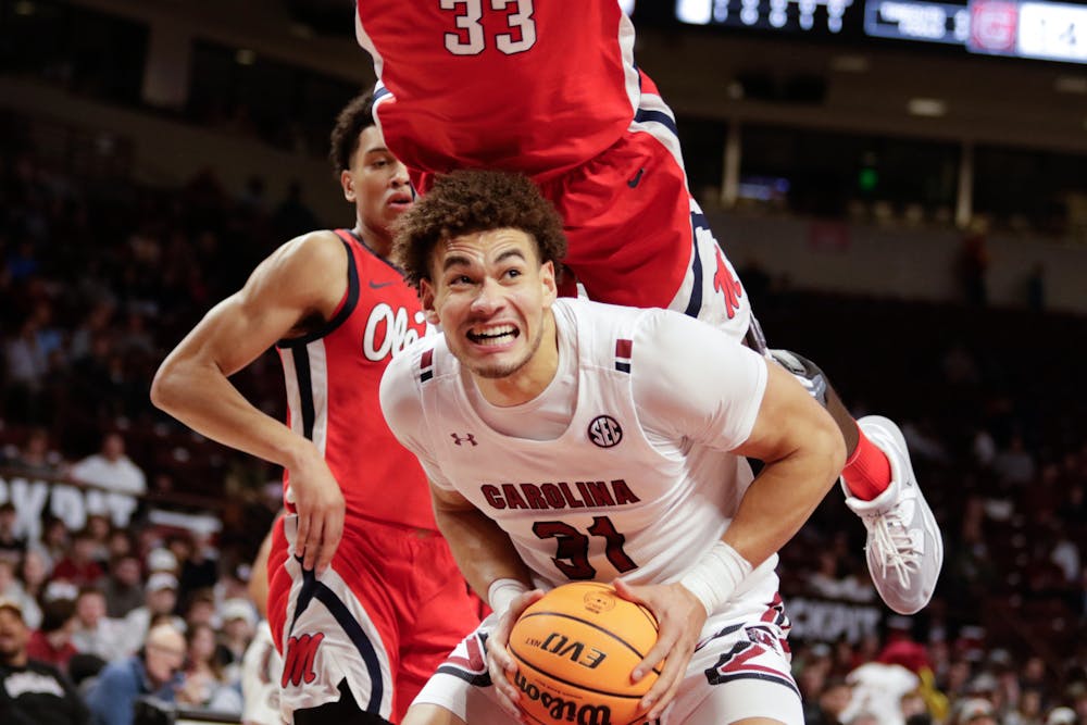 <p>Redshirt junior forward Benjamin Bosmans-Verdonk gets fouled by a player from Ole Miss during the first half of the game at Colonial Life Arena on Jan. 17, 2023. The South Carolina Gamecocks lost to the Rebels 70-58.</p>