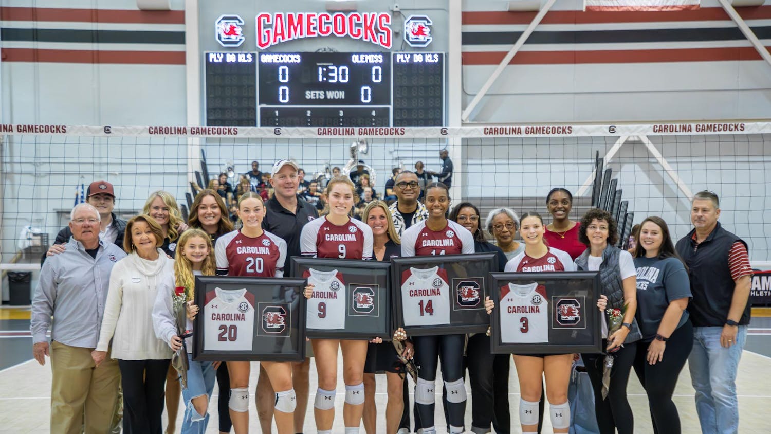 Senior women's volleyball players and their families gather on Senior Day in Columbia, S.C. on Nov. 5, 2023. After the celebration, the Gamecocks swept Ole Miss in three sets.