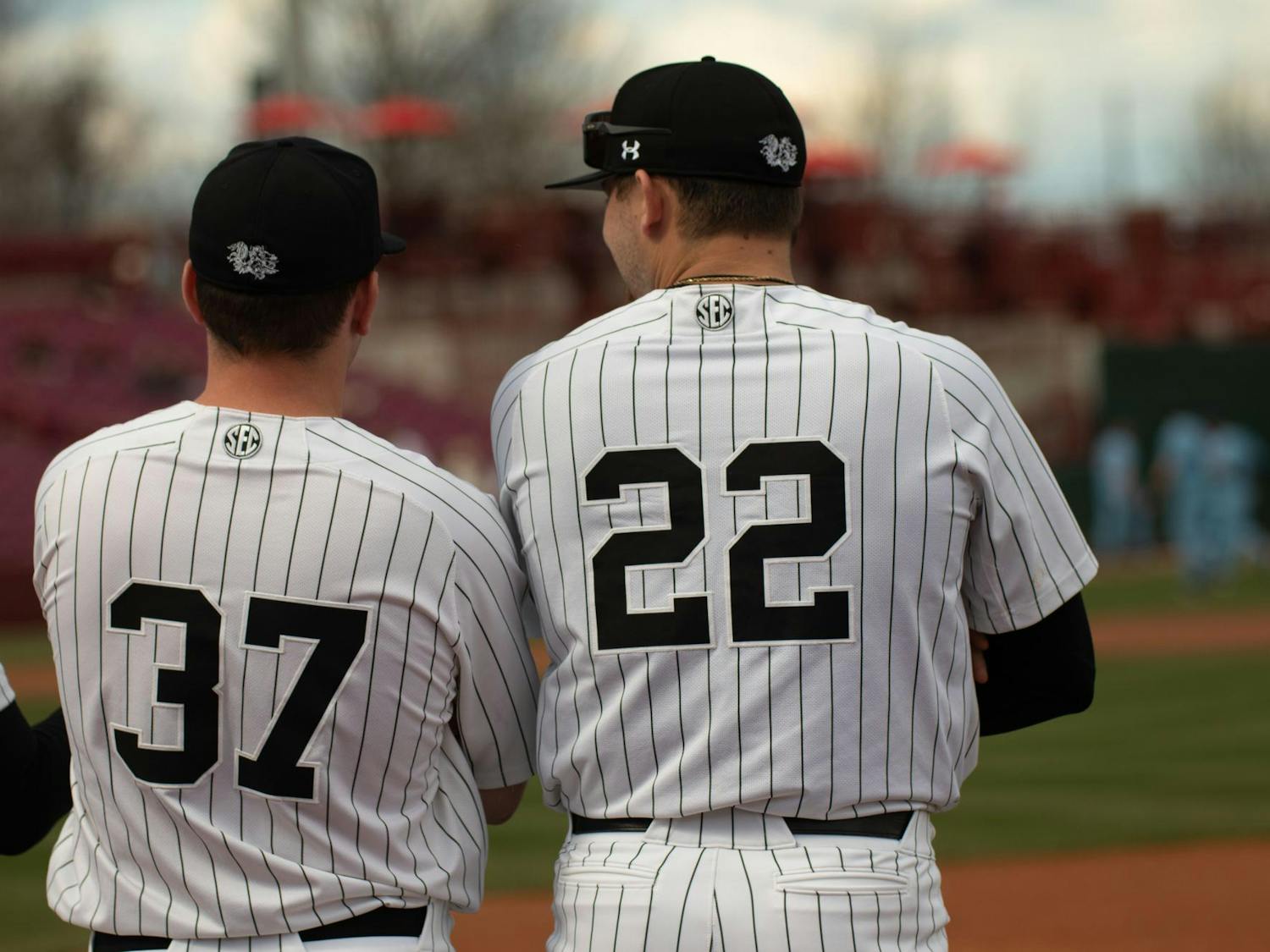 Junior pitcher and infielder Chris Veach and redshirt junior Ricky Williams chat before South Carolina's game against Belmont on Feb. 24, 2024, at Founders Park. Veach threw 32 strikes in 50 pitches during the Gamecocks' 11-2 loss to the Bruins.