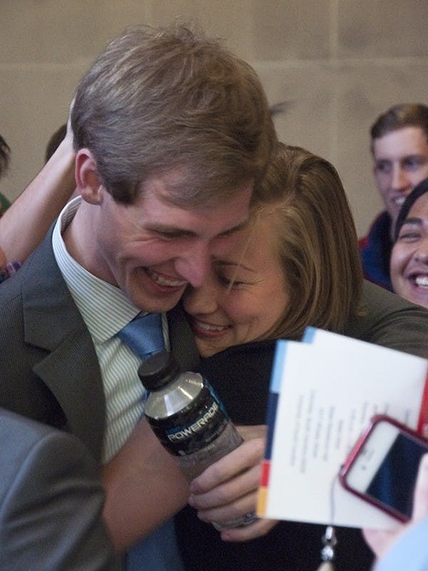 Vice president-elect Ryan Bailey (left) celebrates with treasurer-elect Haley Guyton after winning the Student Government runoff elections.