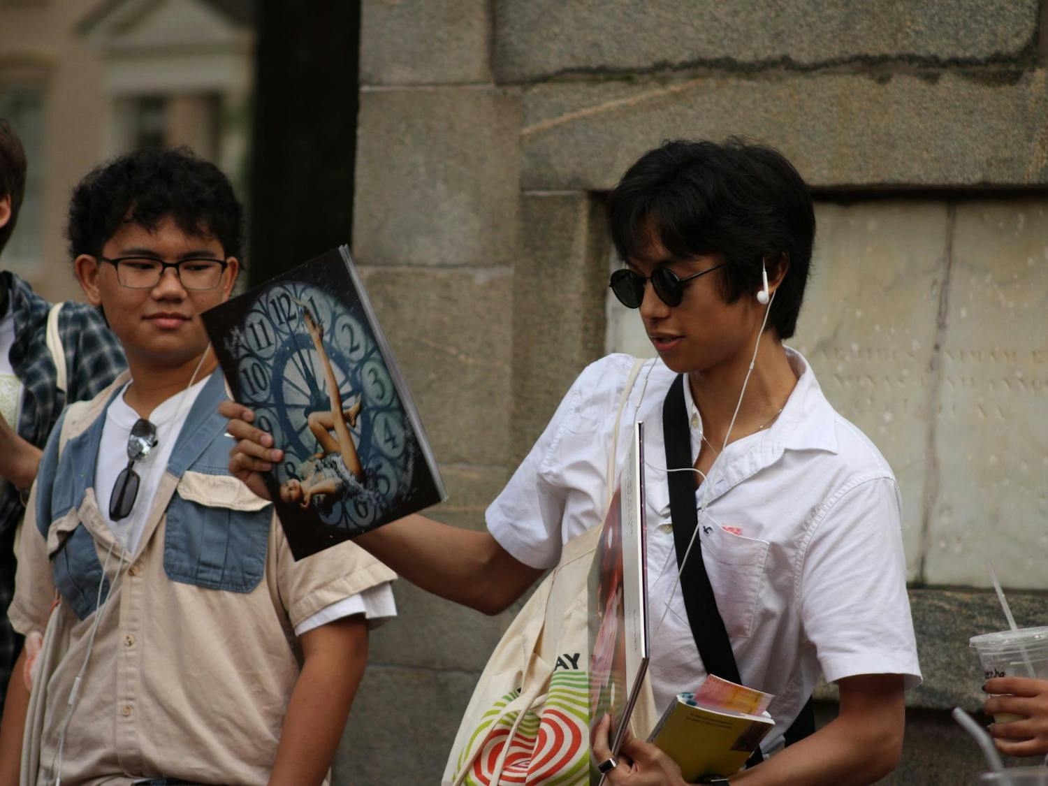 One of the students who participated in the Performative Male Contest, Santi, presents his vinyl records to the audience. Many people came to the Horseshoe on Sept. 20, 2025, to watch his performance along with the other competitors’.
